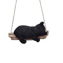 Load image into Gallery viewer, 87957-O - Suspended Cub Serenity: Striking Black Hanging Bear Polyresin Figurine
