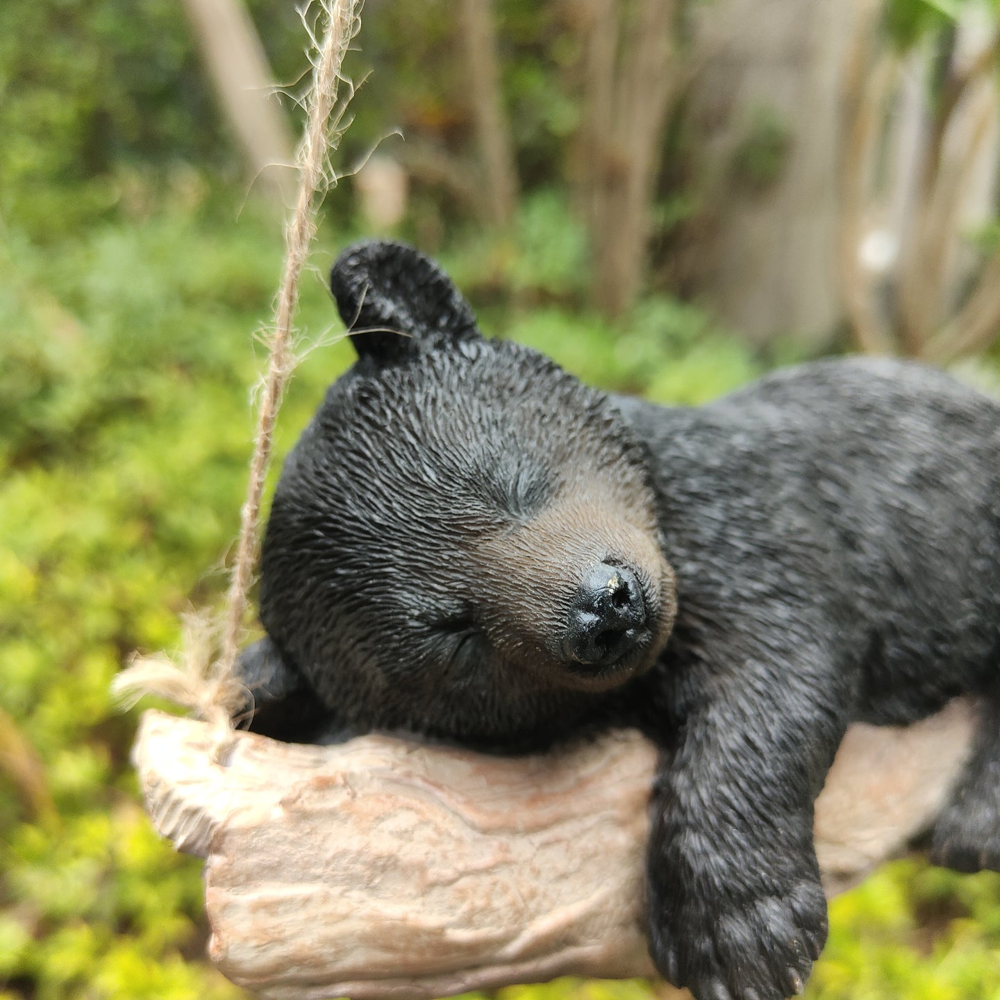 87957-O - Suspended Cub Serenity: Striking Black Hanging Bear Polyresin Figurine