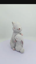 Load and play video in Gallery viewer, 87739-E - Tender Moments: Polyresin Mother &amp; Baby Rabbit Figurine in Elegant White

